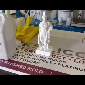 Final plaster Athena casting beside the finished silicone mold