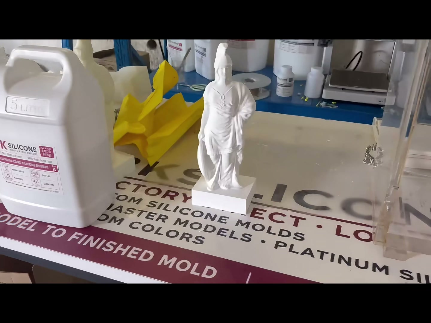 Finished plaster Athena beside the finished silicone mold